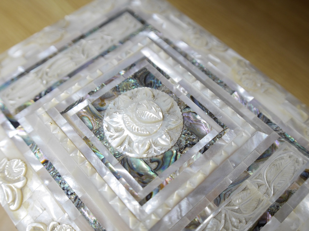 Sundry items comprising a pearl box, a papier mache tray, an inuit type carving and a papier mache box, 28cm wide. Condition - Varies